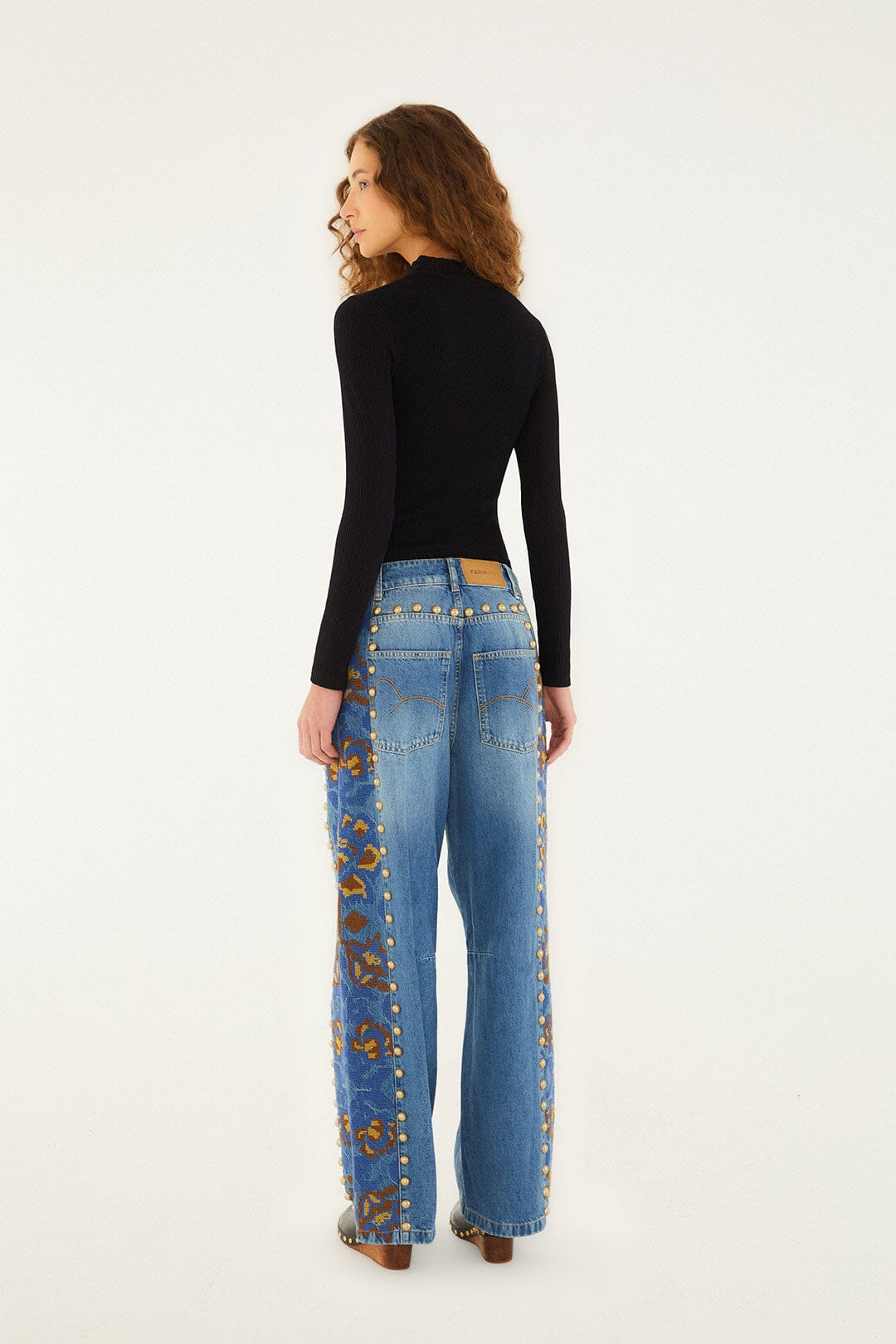 Jeans with studs and floral print